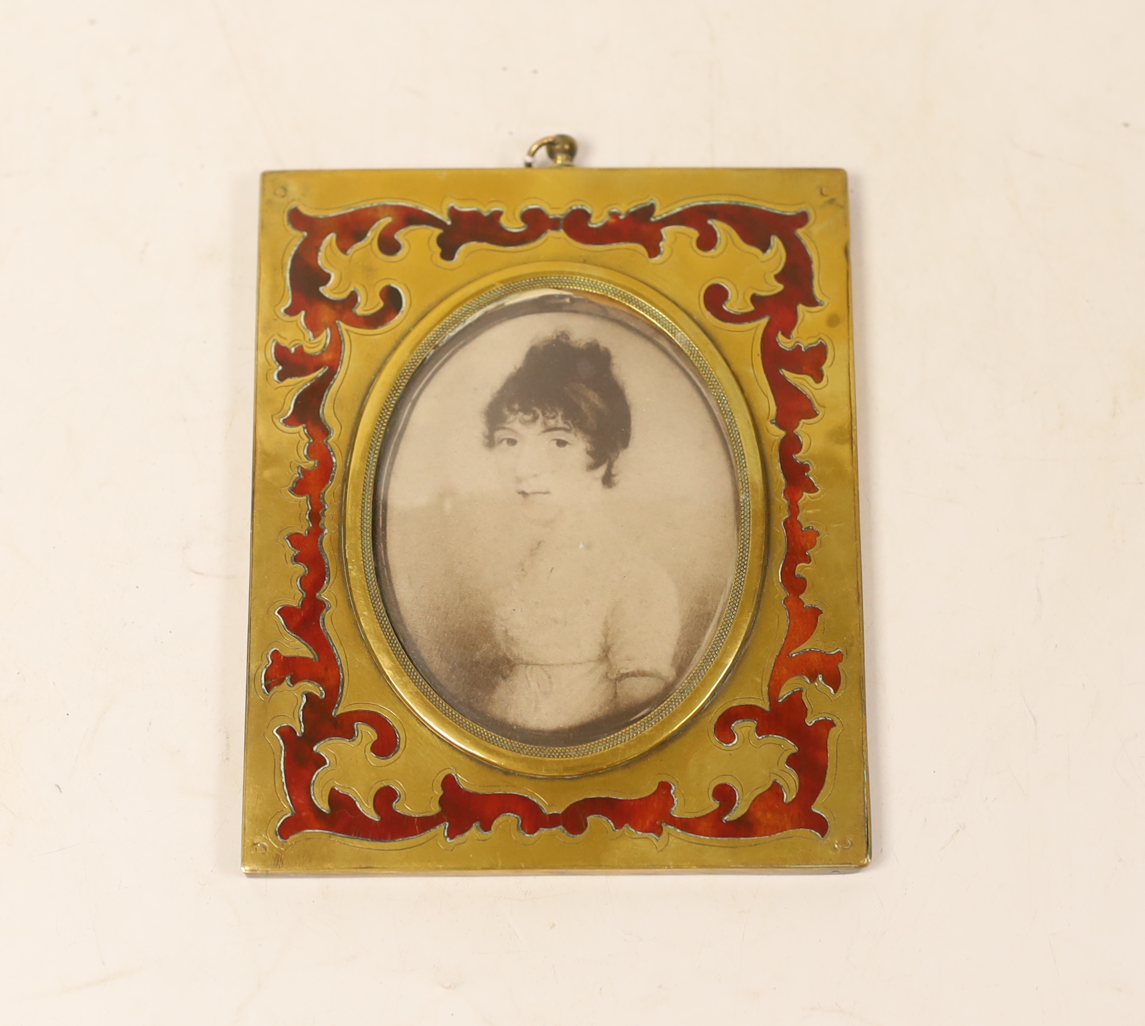 A miniature of a lady on card, in a boulle frame, 13x10cm